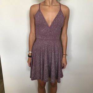 Short, purple, glittery dress
